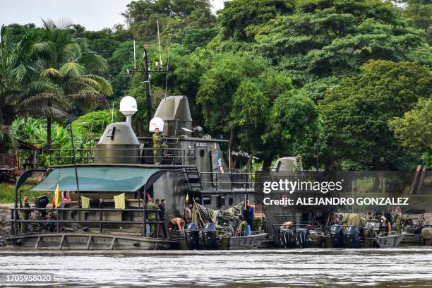 The Colombian Navy helps transport aid along the Meta River in the Colombian department of Vichada as part of the humanitarian plan "Sailing to the...