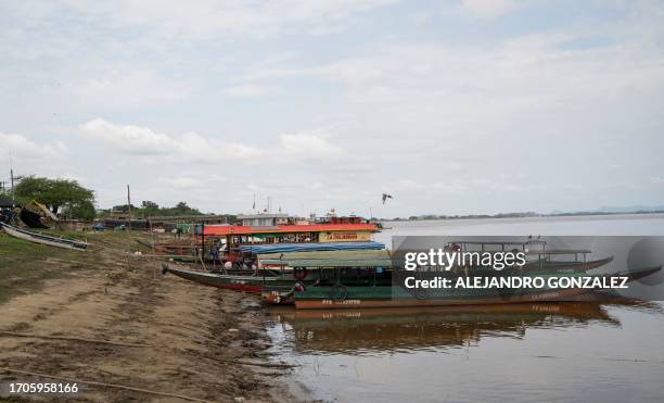Picture of boats on a bank of the Meta River in the Colombian department of Vichada as the Colombian Navy helps transport aid in the area as part of...