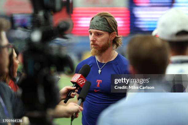 Jon Gray of the Texas Rangers is interviewed on the field before Game 2 of the Wild Card Series between the Texas Rangers and the Tampa Bay Rays at...