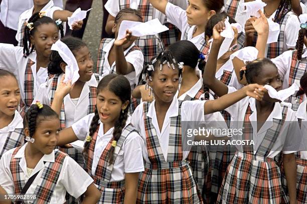 Students from school in Quibido, Choco, Colombia, raise white handkerchiefs during the Silent March, 07 May 2002, in honour of the residents of...
