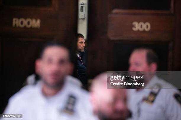 Eric Trump, executive vice president of Trump Organization Inc., center, sits in a court room at New York State Supreme Court in New York, US, on...