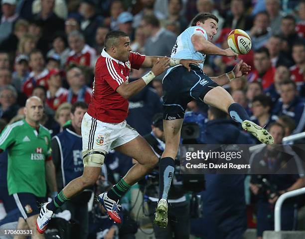 Simon Zebo of the Lions challenges Cam Crawford during the match between the NSW Waratahs and the British & Irish Lions at Allianz Stadium on June...