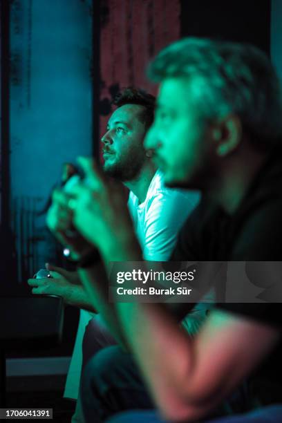 two friends playing console game, gamers, to watch tv - playstation stock pictures, royalty-free photos & images