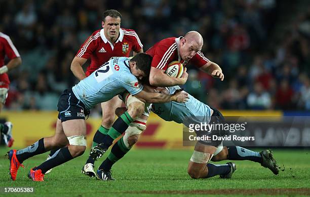 Paul O'Connell of the Lions is tackled by Tom Carter during the match between the NSW Waratahs and the British & Irish Lions at Allianz Stadium on...
