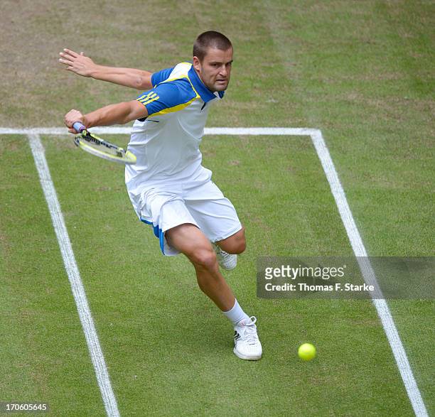 Mikhail Youzhny of Russia plays a backhand in the half final match against Richard Gasquet of France during day six of the Gerry Weber Open at Gerry...