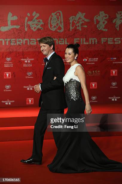 British director Tom Hooper and Chinese actress Yu Nan arrive at the opening ceremony of the 16th Shanghai International Film Festival at Shanghai...