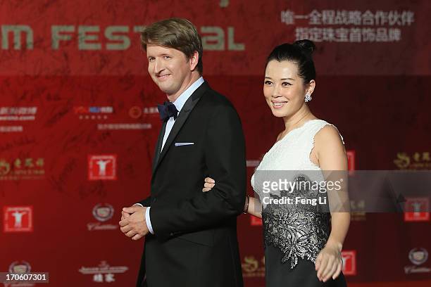 British director Tom Hooper and Chinese actress Yu Nan arrive at the opening ceremony of the 16th Shanghai International Film Festival at Shanghai...