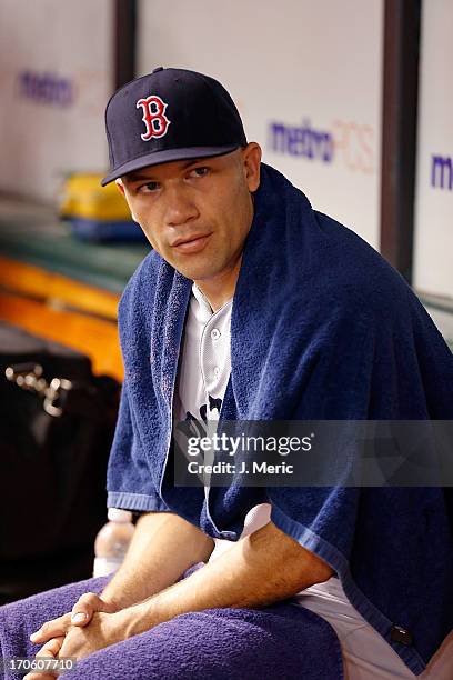 Pitcher Alfredo Aceves of the Boston Red Sox rests between innings during the game against the Tampa Bay Rays at Tropicana Field on June 12, 2013 in...