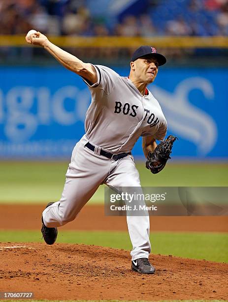 Pitcher Alfredo Aceves of the Boston Red Sox pitches against the Tampa Bay Rays at Tropicana Field on June 12, 2013 in St. Petersburg, Florida.