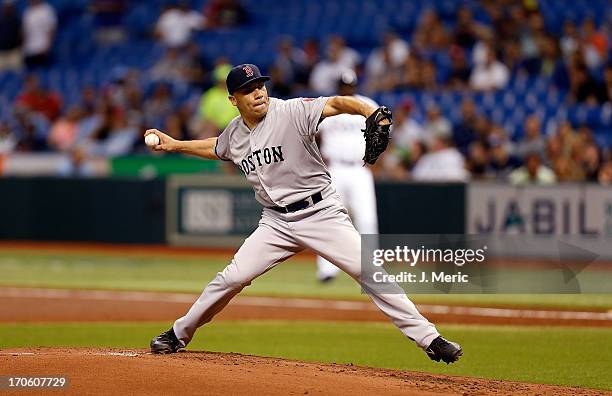 Pitcher Alfredo Aceves of the Boston Red Sox pitches against the Tampa Bay Rays at Tropicana Field on June 12, 2013 in St. Petersburg, Florida.