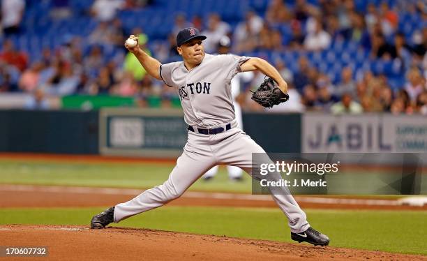 Pitcher Alfredo Aceves of the Boston Red Sox pitches against the Tampa Bay Rays at Tropicana Field on June 12, 2013 in St. Petersburg, Florida.