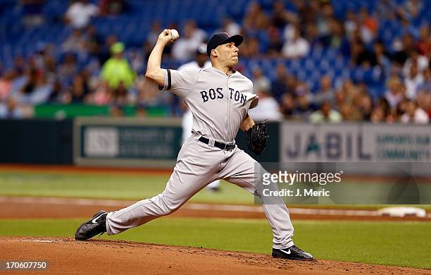Pitcher Alfredo Aceves of the Boston Red Sox pitches against the Tampa Bay Rays at Tropicana Field on June 12, 2013 in St. Petersburg, Florida.