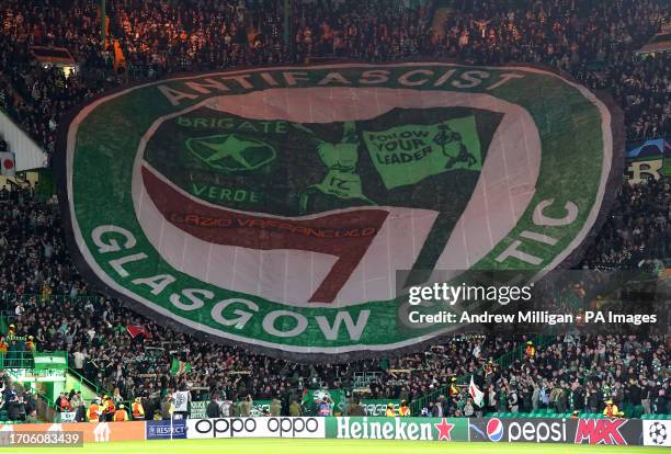 Celtic fans in the stands hold up a banner during the UEFA Champions League Group E match at Celtic Park, Glasgow. Picture date: Wednesday October 4,...