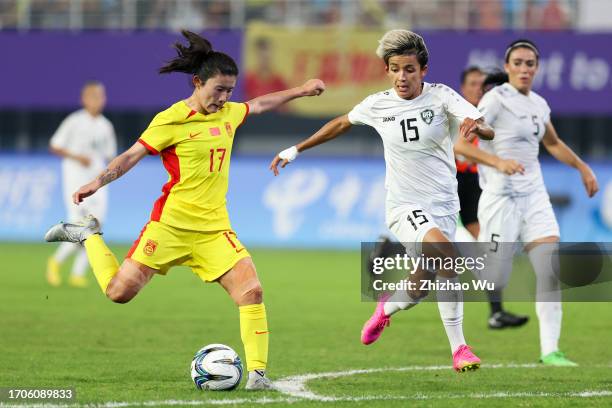 Yan Jinjin of China shots during the 19th Asian Games Women Group A match between Uzbekistan and China at Linping Sports Centre Stadium on September...