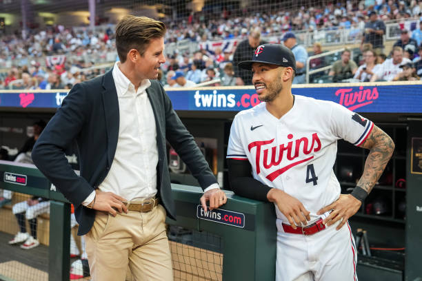 Executive chair Joe Pohlad of the Minnesota Twins looks on with Carlos Correa against the Los Angeles Angels on September 22, 2023 at Target Field in...