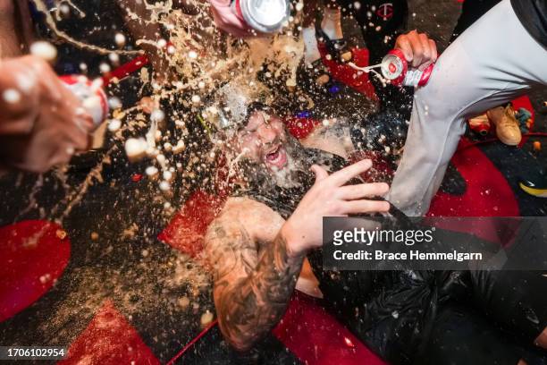 Dallas Keuchel of the Minnesota Twins celebrates after clinching the AL Central Division against the Los Angeles Angels on September 22, 2023 at...