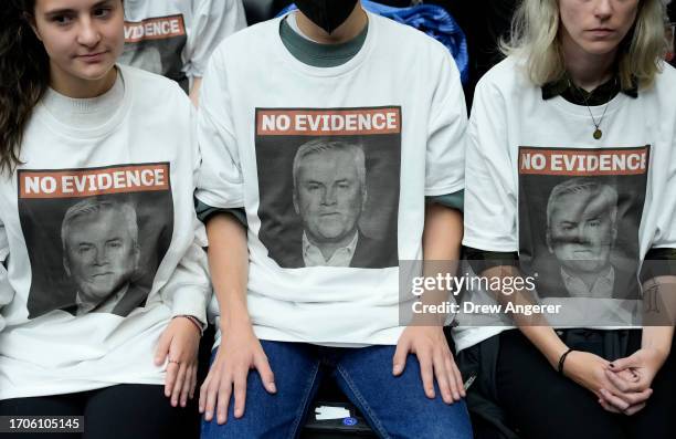 Demonstrators wear shits with the picture of Chairman of the House Oversight Committee James Comer on them during a Committee hearing titled “The...