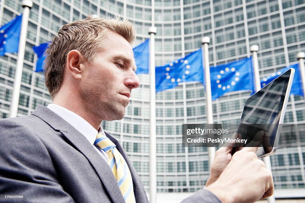 Businessman Uses Digital Tablet Computer at European Commission Brussels