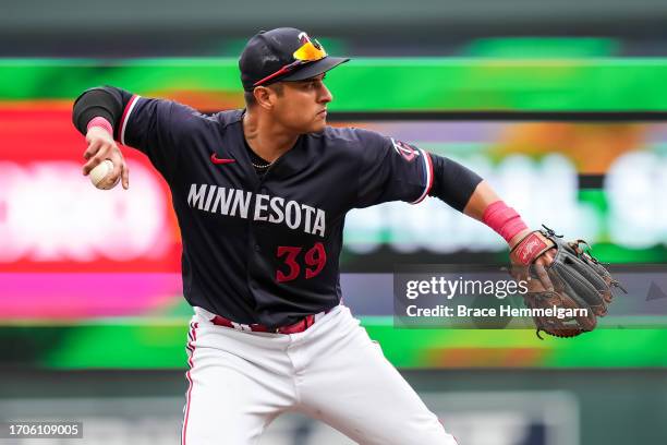 Donovan Solano of the Minnesota Twins throws against the Los Angeles Angels on September 23, 2023 at Target Field in Minneapolis, Minnesota.