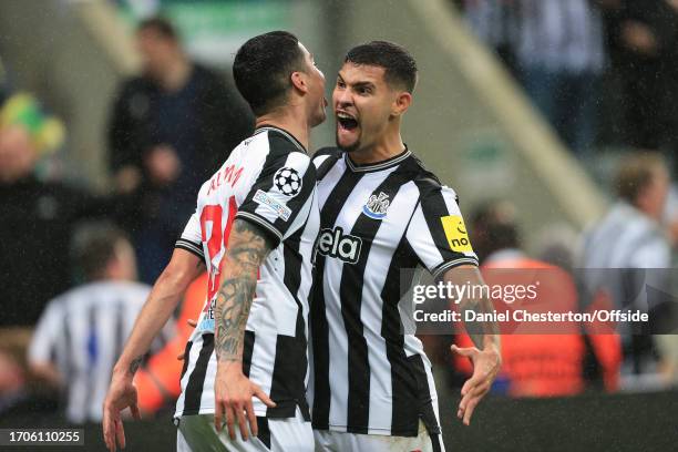 Miguel Almiron of Newcastle United celebrates their first goal with Bruno Guimaraes of Newcastle United during the UEFA Champions League match...