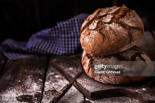 brown bread - round loaf stock pictures, royalty-free photos & images