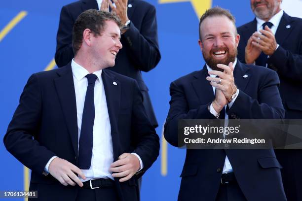 Robert MacIntyre and Shane Lowry of Team Europe react during the opening ceremony for the 2023 Ryder Cup at Marco Simone Golf Club on September 28,...