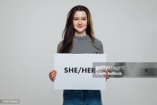 using she/her pronouns - person holding up sign bildbanksfoton och bilder