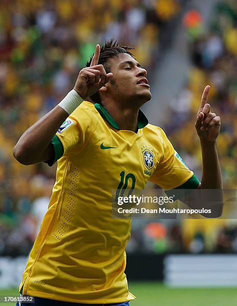 Neymar of Brazil celebrates scoring his team's opening goal during the FIFA Confederations Cup Brazil 2013 Group A match between Brazil and Japan at...