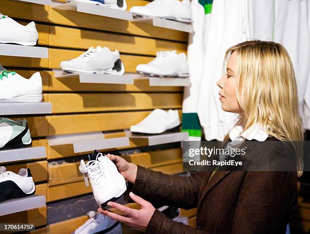 shopping for sports shoes - shoe collection stockfoto's en -beelden