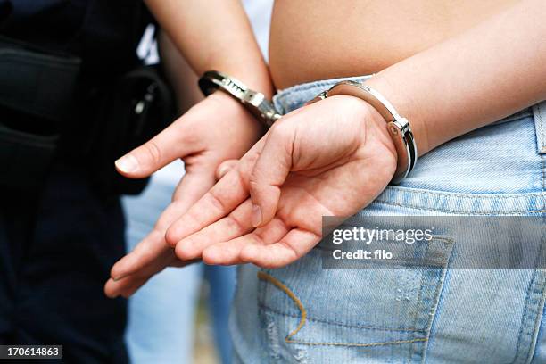 handcuffed - teen arrest stock pictures, royalty-free photos & images