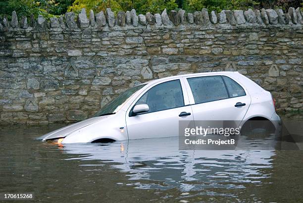 car stuck in rural flooding - damaged stock pictures, royalty-free photos & images