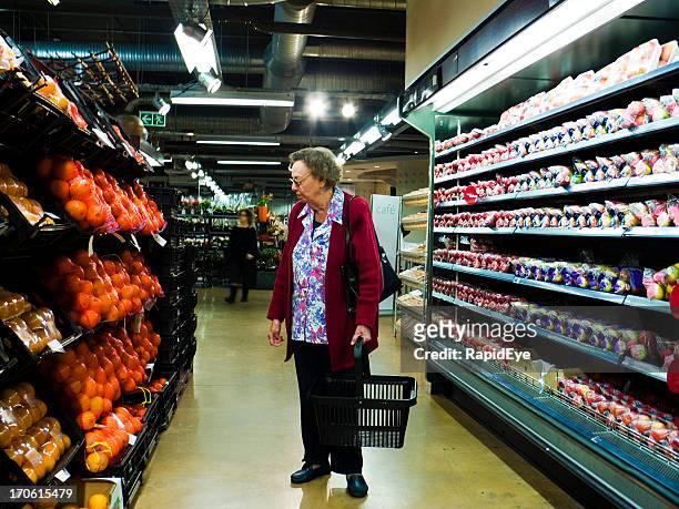 senior at the supermarket - senior women shopping stock pictures, royalty-free photos & images