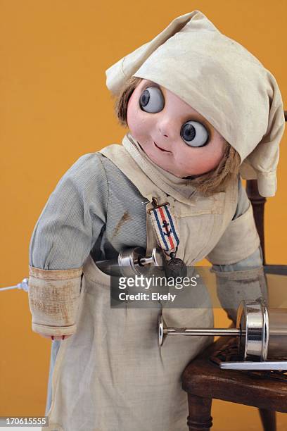 busy nurse doll with syringes. - vintage brooch stock pictures, royalty-free photos & images