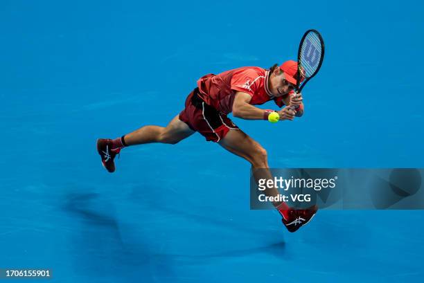 Alex De Minaur of Australia returns a shot in the Men's Singles Round of 32 match against Andy Murray of Great Britain on day three of 2023 China...