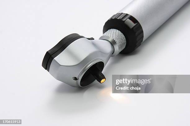 medical instrument.otoscope con lámpara encendida - otitis fotografías e imágenes de stock