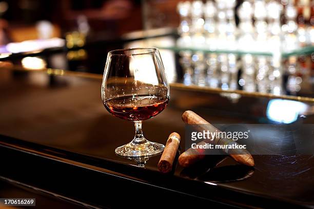 cognac and cigars - cognac stockfoto's en -beelden