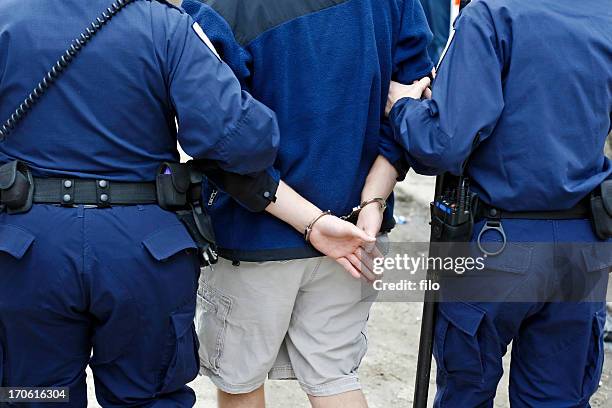 arrested man - protest arrest stock pictures, royalty-free photos & images