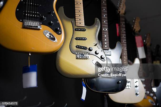 electric guitars - guitar shop stock pictures, royalty-free photos & images