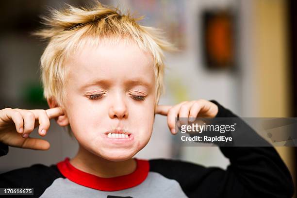 too noisy! - kid eyes closed stock pictures, royalty-free photos & images