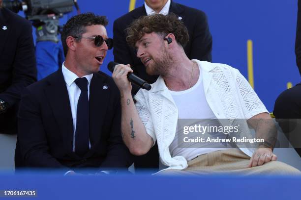 Musician, Tom Grennan performs alongside Rory McIlroy of Team Europe during the opening ceremony for the 2023 Ryder Cup at Marco Simone Golf Club on...
