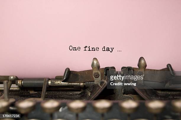 one fine day....on antique typewriter - poet stock pictures, royalty-free photos & images