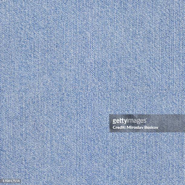 luz de alta resolución de polvo de tela azul lugar de muestra - jeans fotografías e imágenes de stock