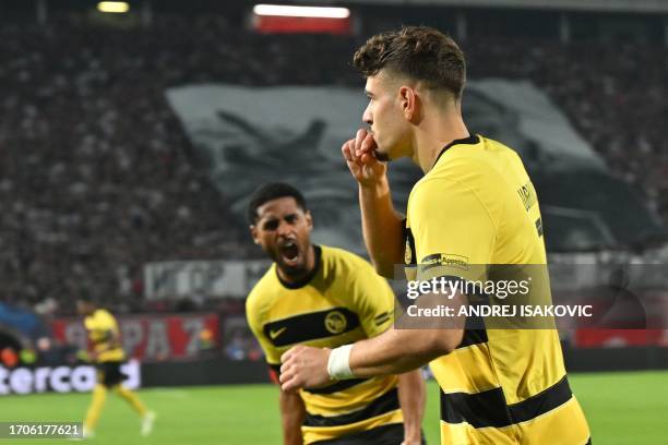 Young Boys' Swiss midfielder Filip Ugrinic celebrates scoring his team's first goal during the UEFA Champions League 1st round day 2 Group G football...