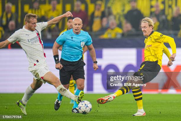 Tommaso Pobega of AC Milan, Julian Brandt of Borussia Dortmund battle for the ball during the UEFA Champions League Group F match between Borussia...