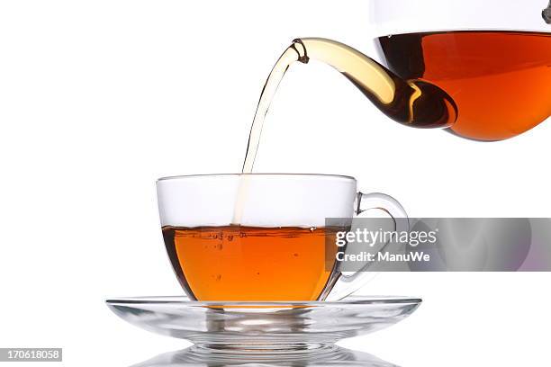 pouring tea into glass cup - tea pot stock pictures, royalty-free photos & images