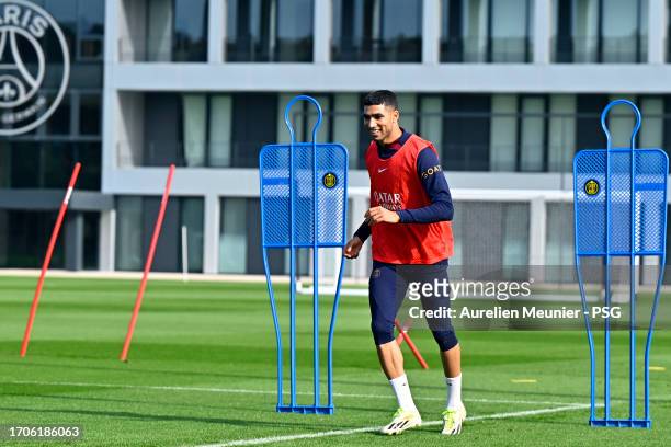 Achraf Hakimi warms up during a Paris Saint-Germain training session at Campus PSG on September 28, 2023 in Paris, France.