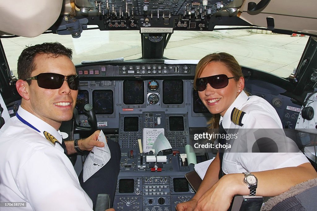 Young pilots flaying in cockpit of commercial jet