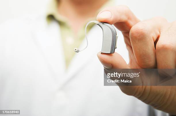 aparellho auditivo - hearing aid - fotografias e filmes do acervo