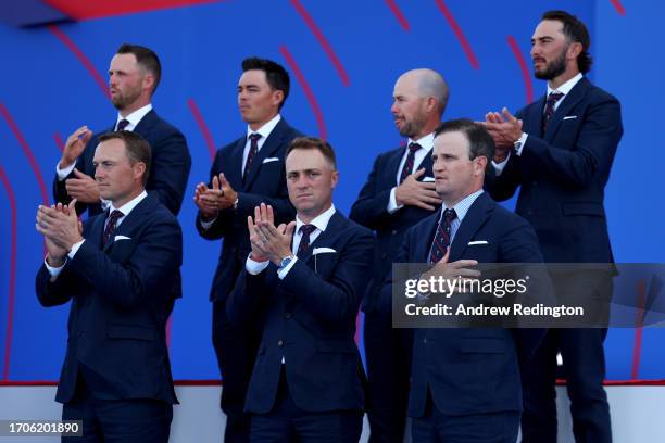 Jordan Spieth, Justin Thomas and Zach Johnson, Captain of Team United States react during the opening ceremony for the 2023 Ryder Cup at Marco Simone...