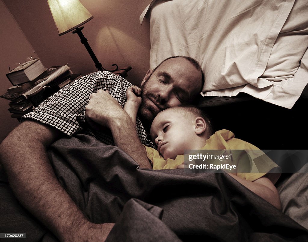 Dad and child fast asleep